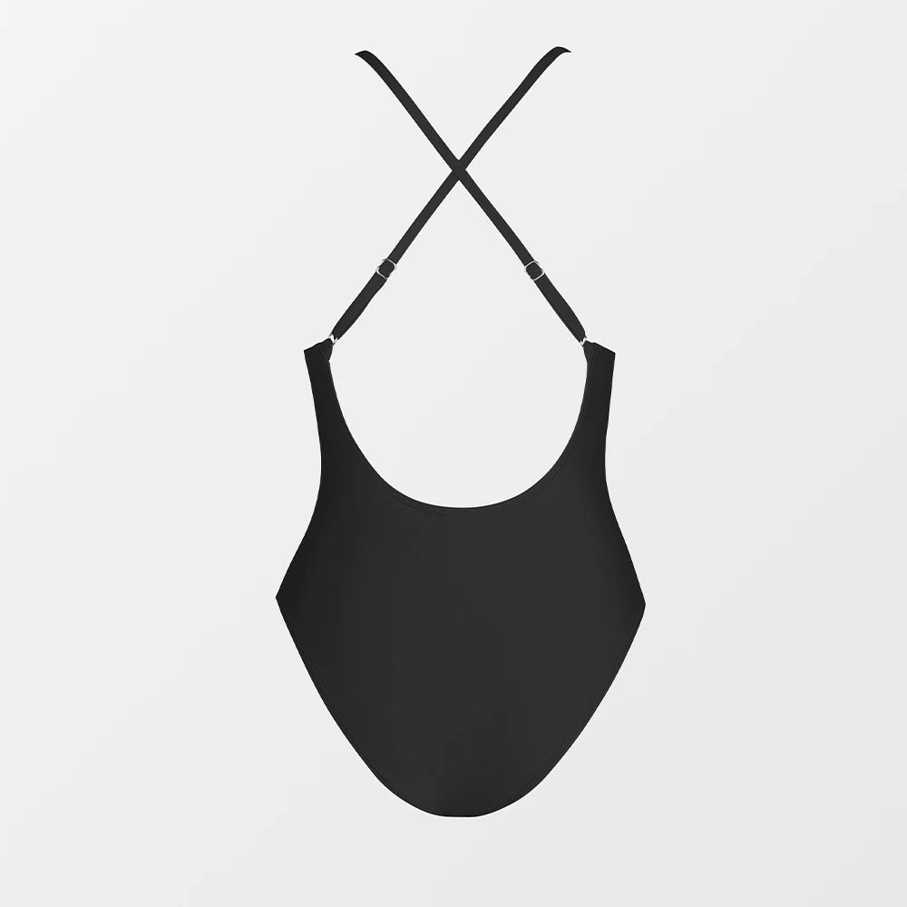 Black swimsuit with thin straps on a light gray background
