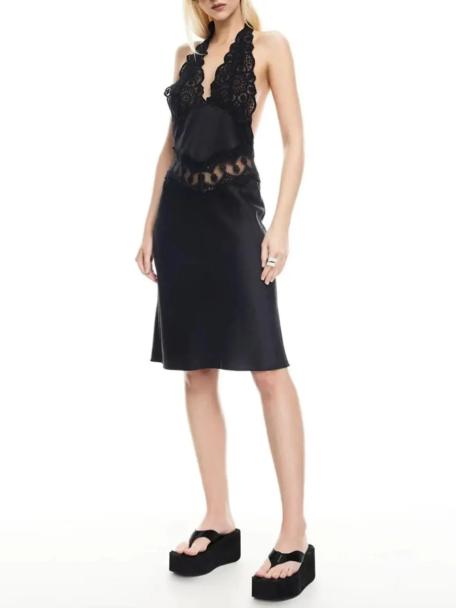 Woman wearing a black lace dress on a white background
