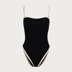 Black swimsuit with thin straps on a light gray background