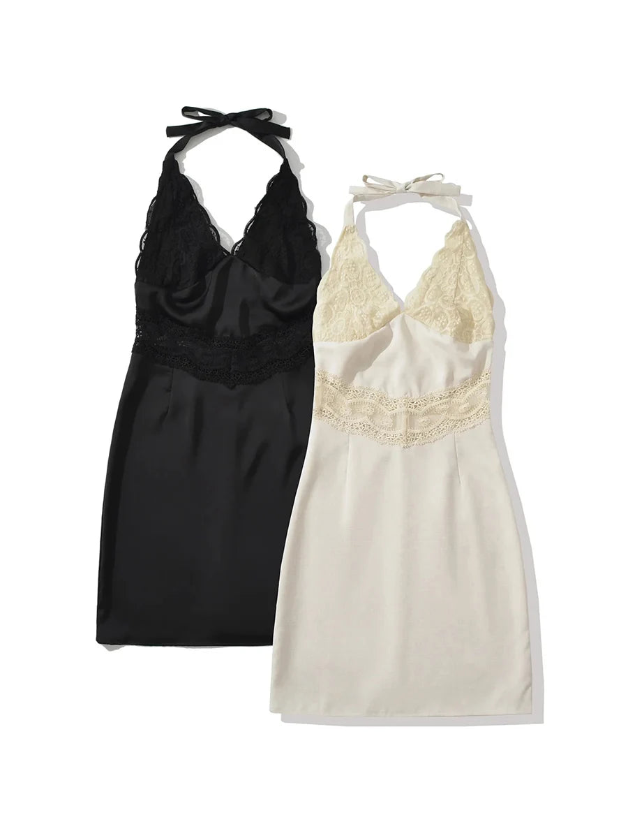 Black and white halter neck dresses with lace details on a white background