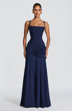 Navy blue strapless gown on a white background