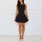 Woman wearing a black dress with a white background