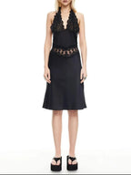Black dress with lace details on a white background