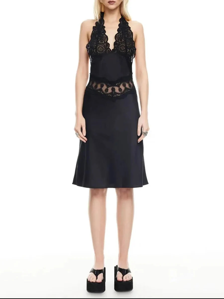 Black dress with lace details on a white background