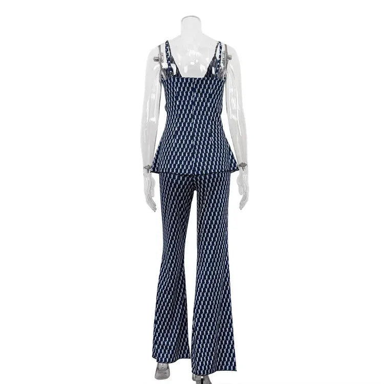 Mannequin wearing a navy patterned jumpsuit on a white background