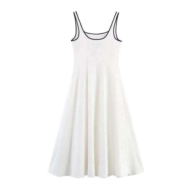 White sleeveless dress with black trim on a white background
