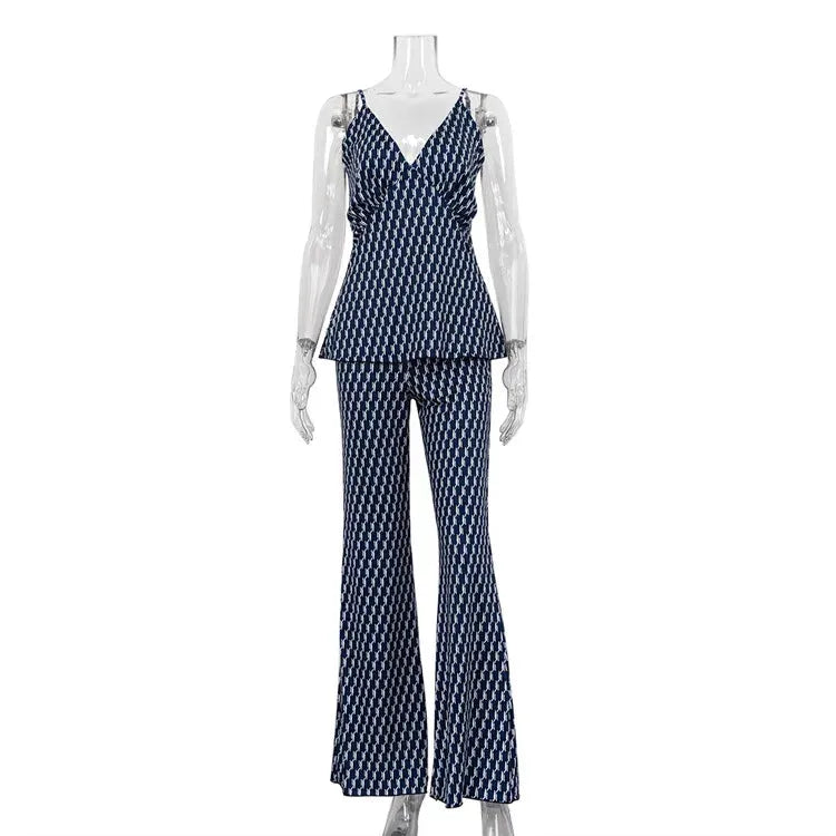Mannequin wearing a navy patterned suit on a white background