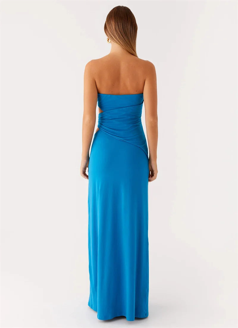 Woman wearing a blue strapless gown on a white background