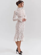 Woman wearing a white lace dress on a light gray background