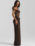 Woman wearing a brown off-shoulder evening gown on a white background