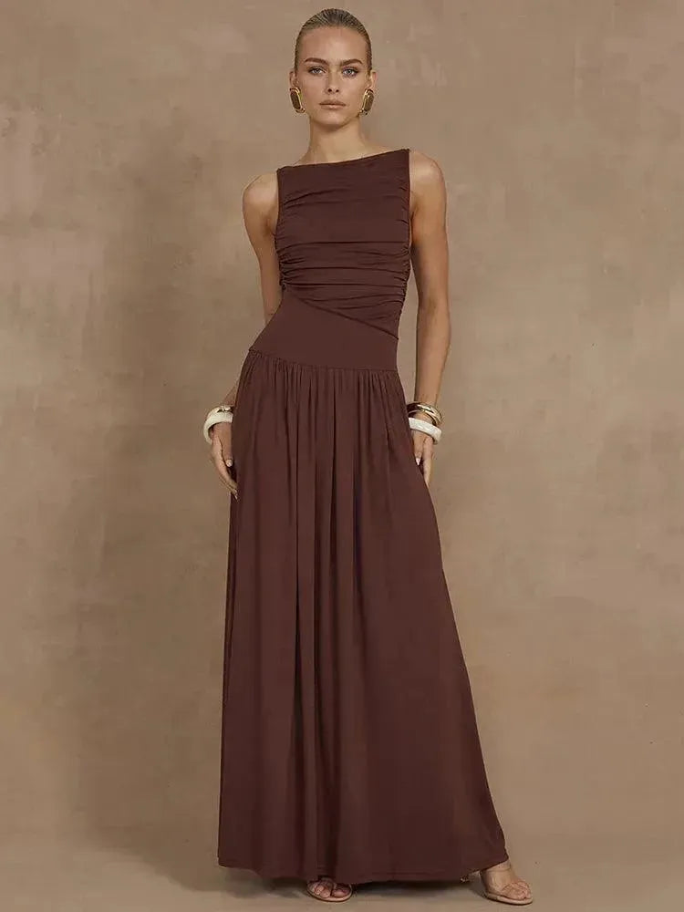 Woman wearing a brown one-shoulder dress against a brown background