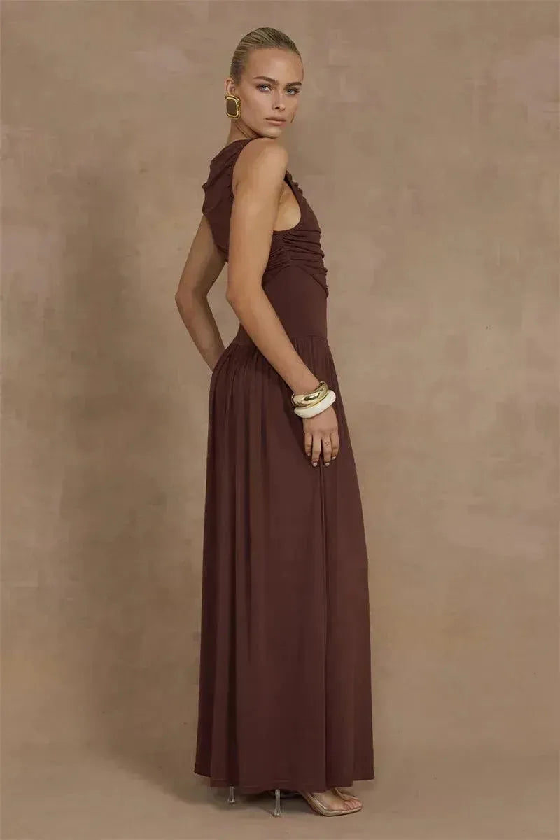 Woman in a brown dress against a brown background
