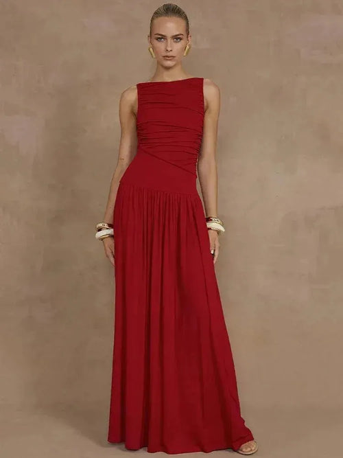 Model wearing a red dress against a brown background