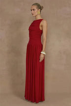 Woman wearing a red dress against a brown background