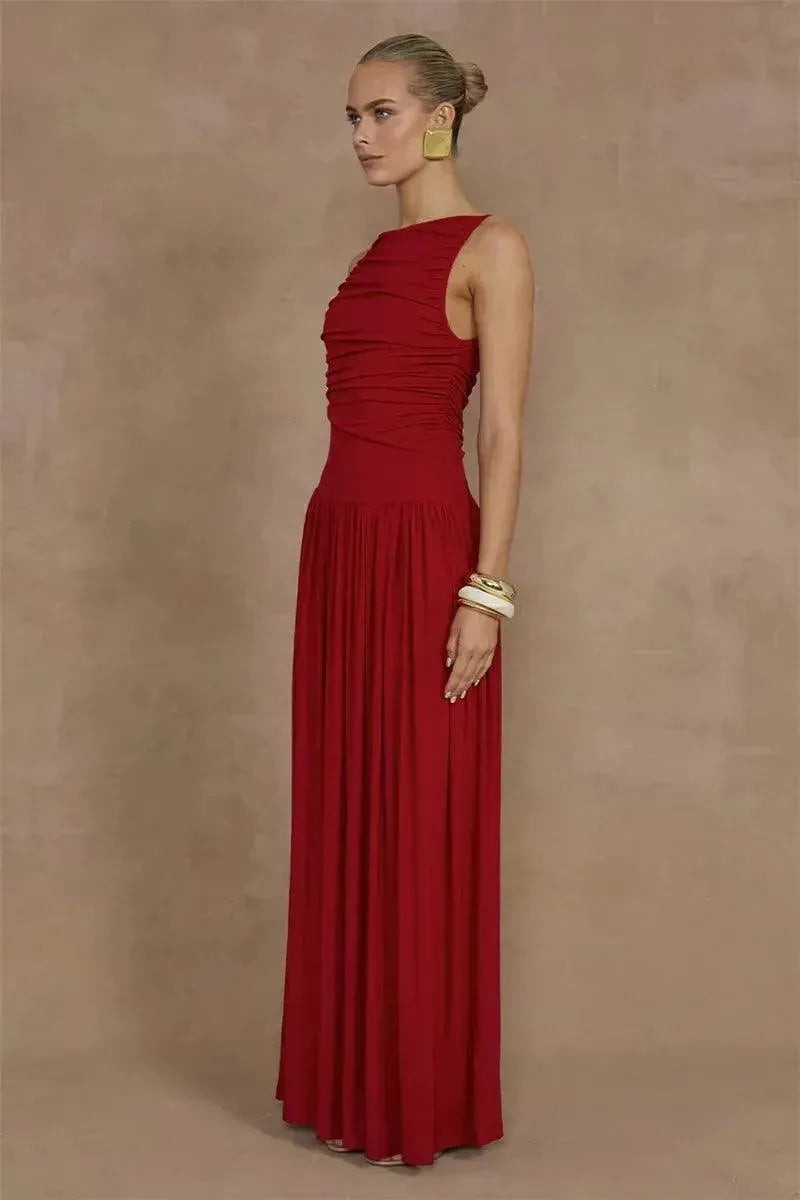 Woman wearing a red dress against a brown background