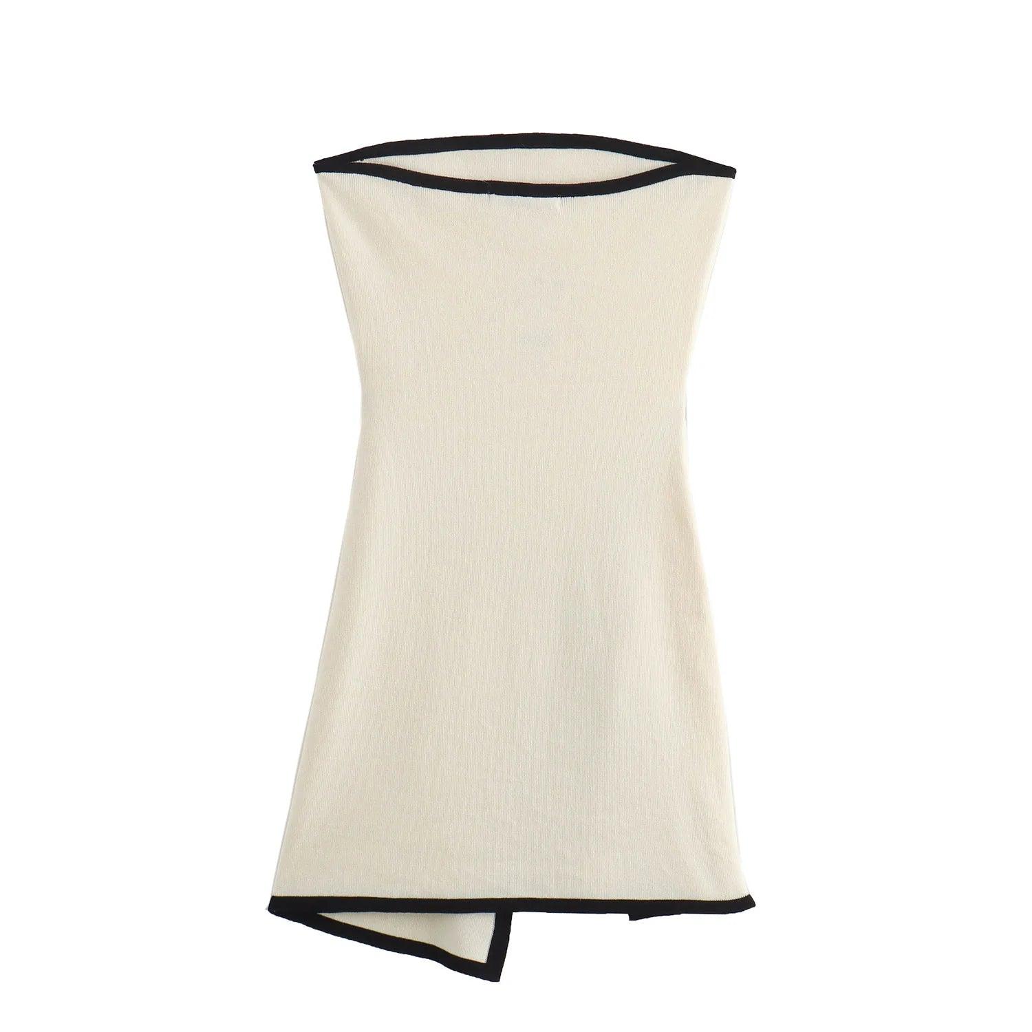 A white strapless mini dress with a solid backless design above knee, featuring a black belt.