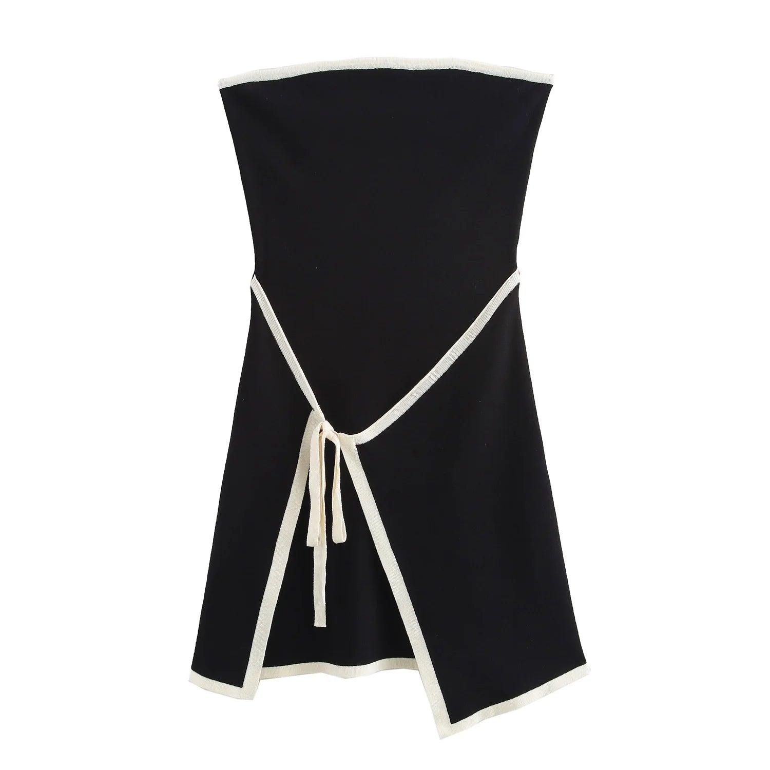 A black strapless mini dress with a solid backless design above knee, featuring a black belt.