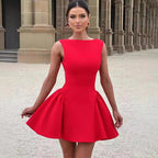 A woman wearing a red, A-line mini dress with a sweetheart neckline and above knee length.