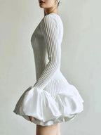 White pleated dress on a plain background